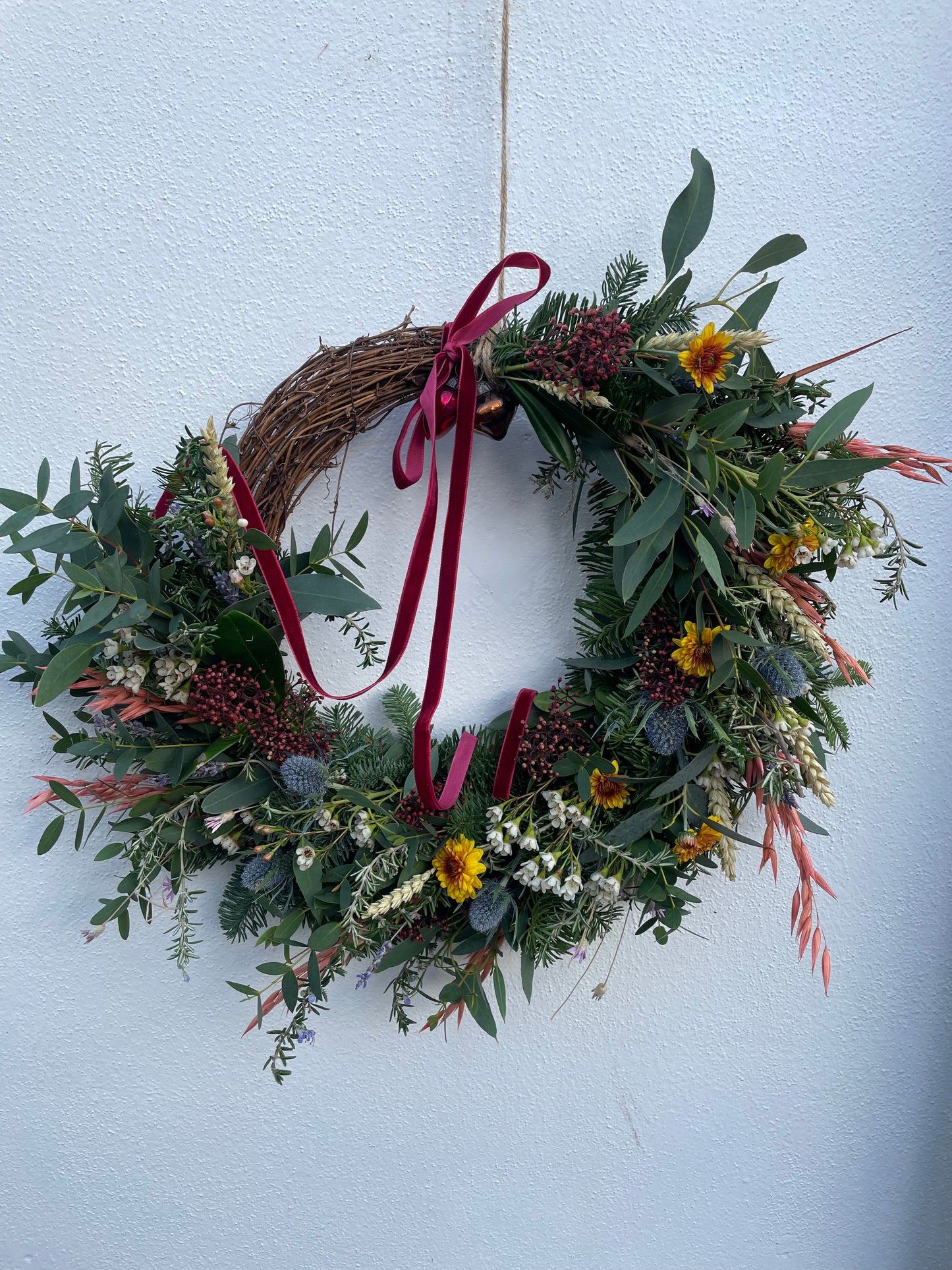 Fresh and dried Christmas wreath with natural greenery and glass baubles – Barns Florals Cornwall.