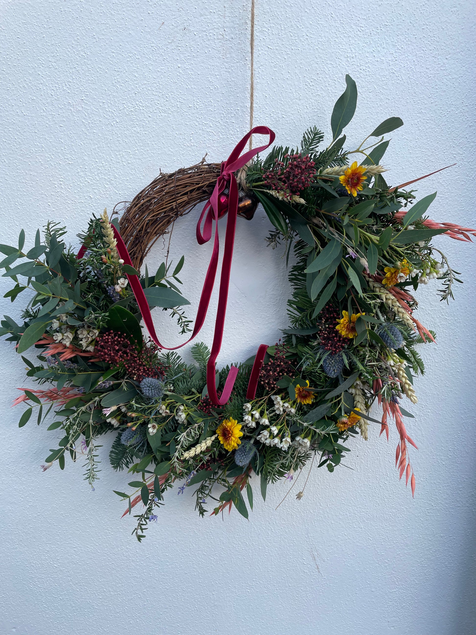 Fresh and dried Christmas wreath with natural greenery and glass baubles – Barns Florals Cornwall.