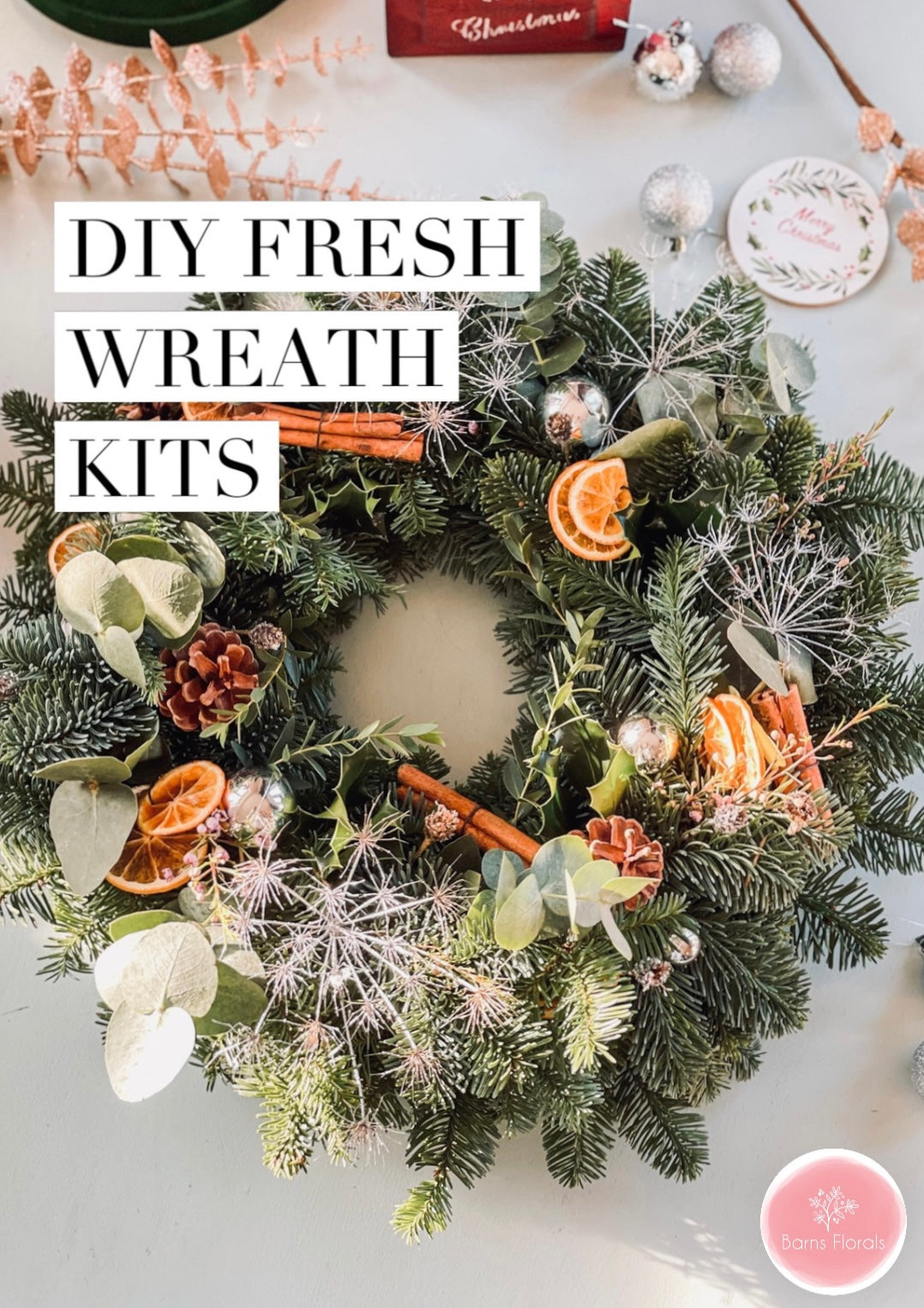DIY Christmas wreath kit with fresh foliage, dried oranges, and ribbon – handmade by Barns Florals.