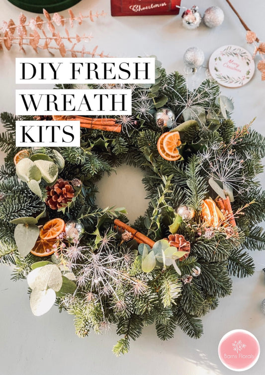 DIY Christmas wreath kit with fresh foliage, dried oranges, and ribbon – handmade by Barns Florals.