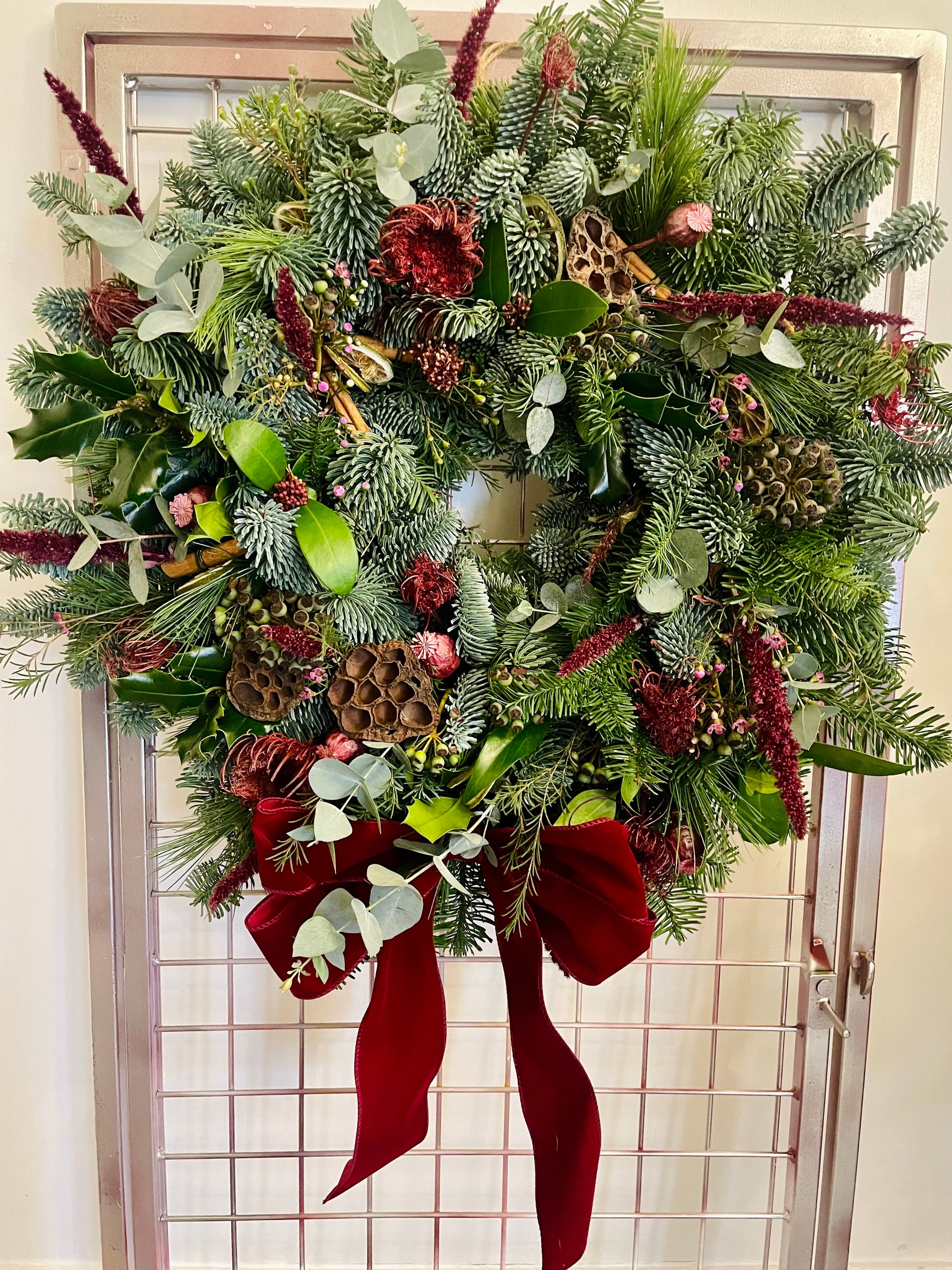 Mulled Berries & Wine Christmas wreath with spruce, eucalyptus, and cinnamon – handmade by Barns Florals.