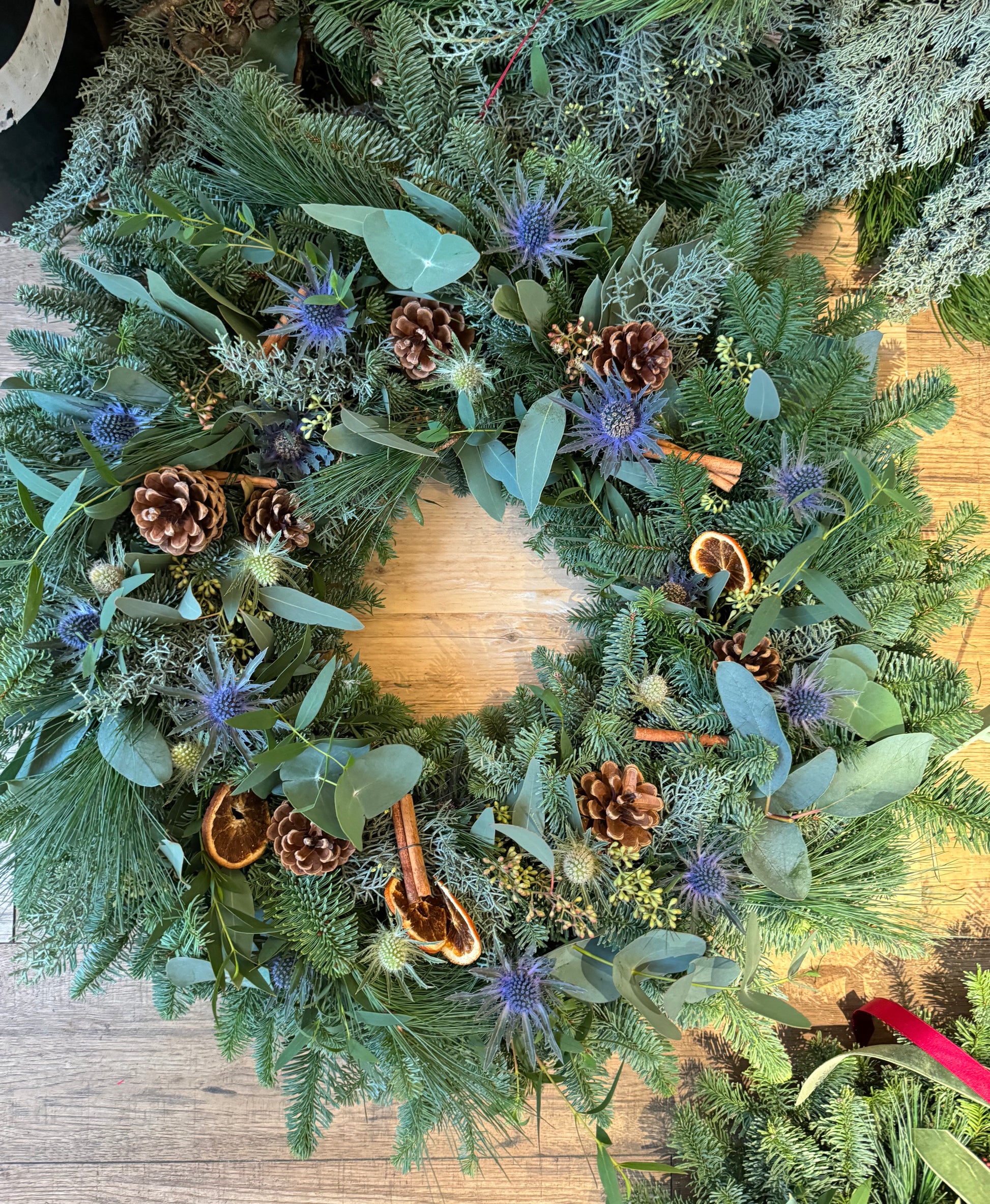 Side view of eucalyptus and pine Christmas wreath with rich texture and natural fragrance.