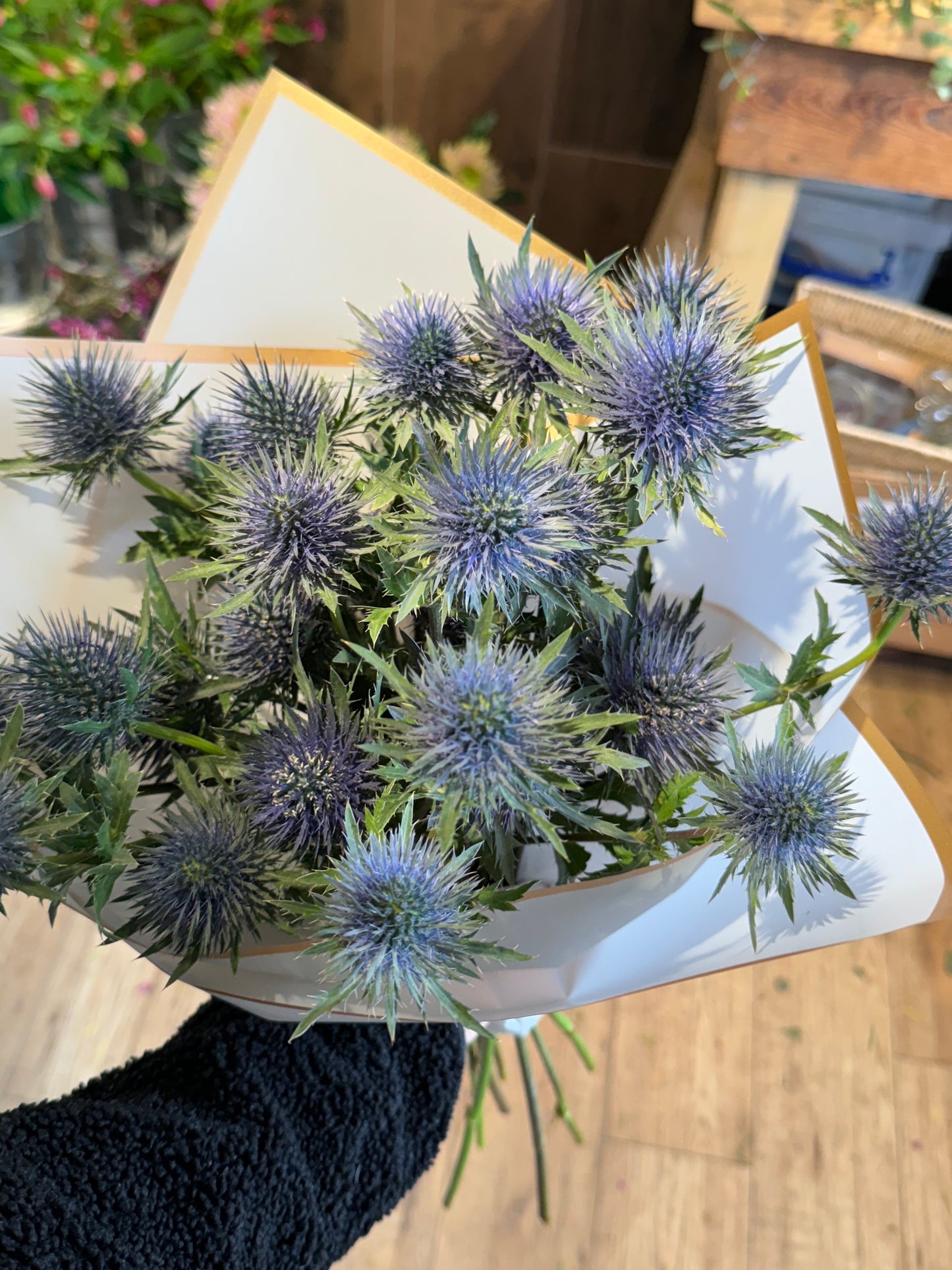 Blue eryngium flower bunch with sculptural stems and thistles – Barns Florals.