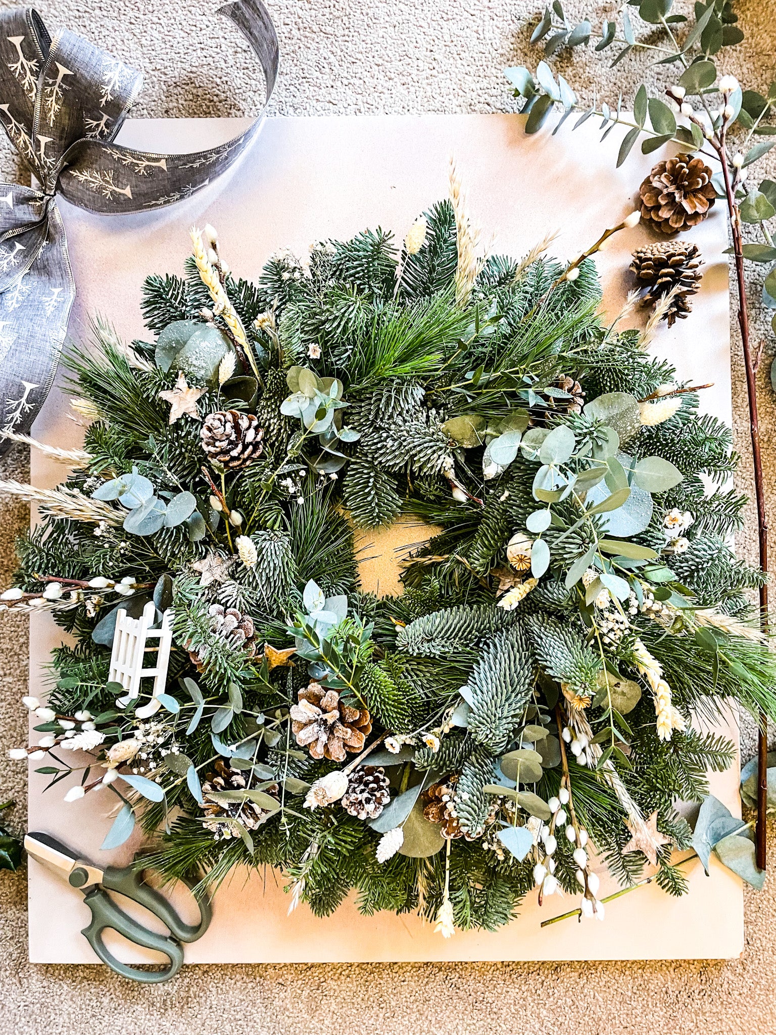 Side view of winter foliage wreath with eucalyptus and pine – Barns Florals Cornwall.