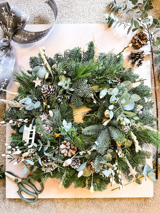 Side view of winter foliage wreath with eucalyptus and pine – Barns Florals Cornwall.