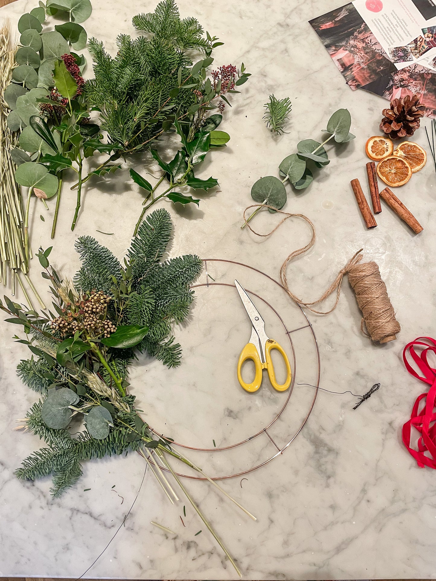 Christmas wreath making kit contents including spruce, eucalyptus, ribbon, and decorations – Barns Florals.